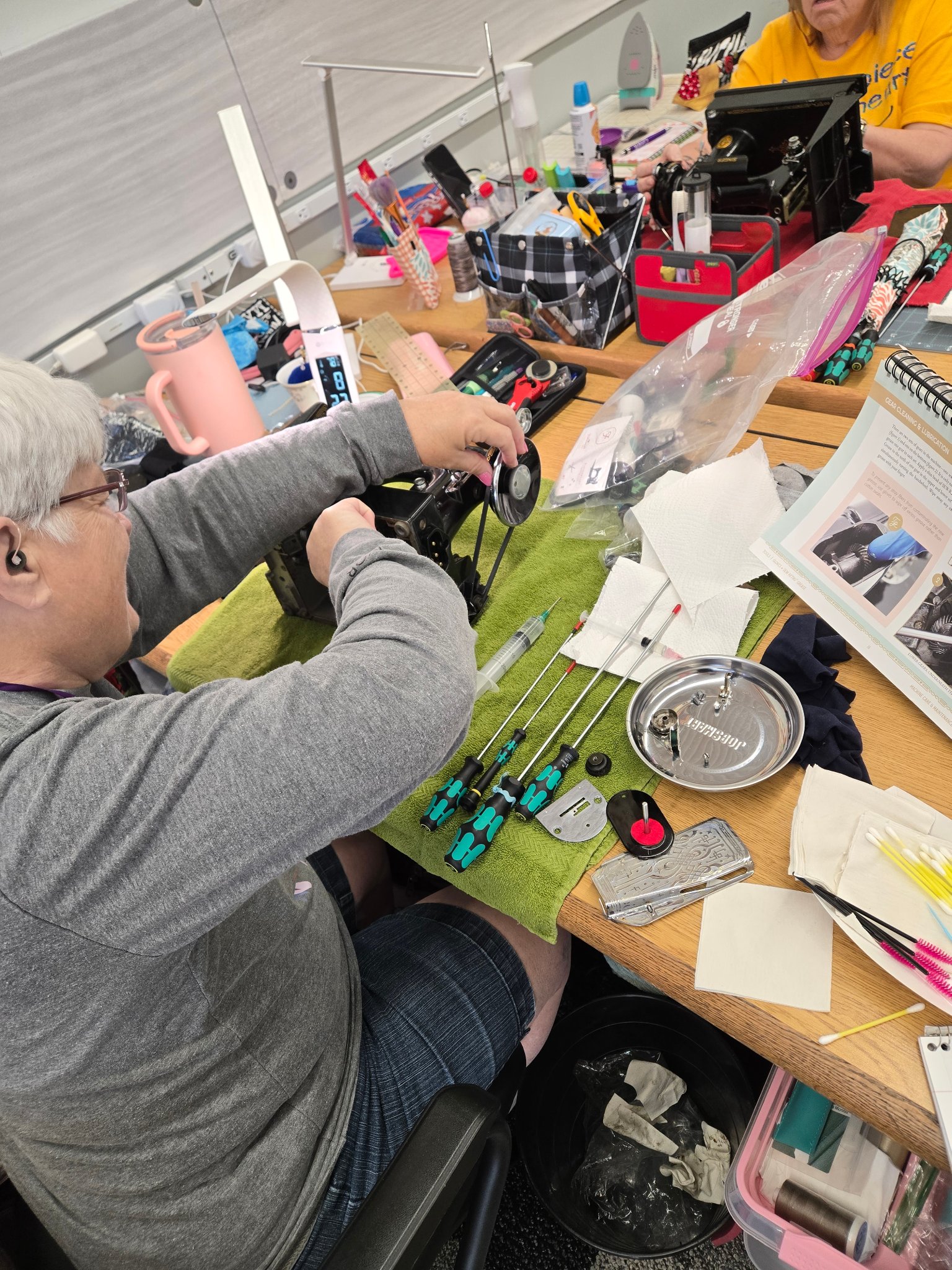 Student working on Featherweight maintenance during a spa day class