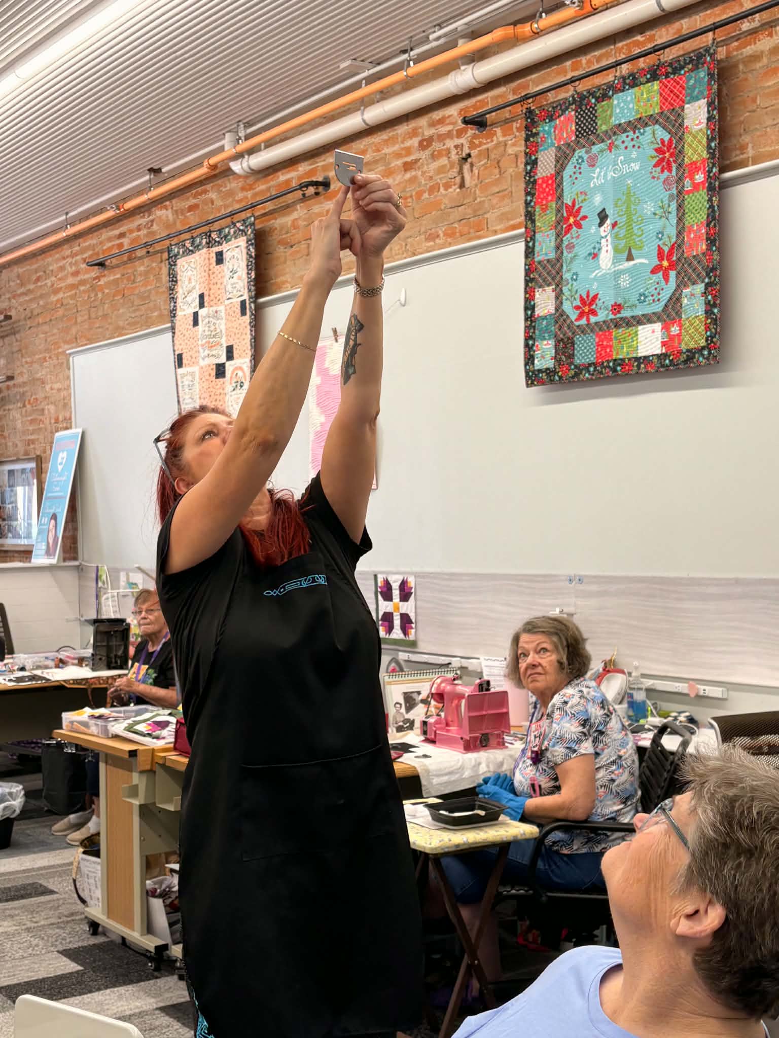 Sarah teaching Featherweight maintenance to retreat attendees