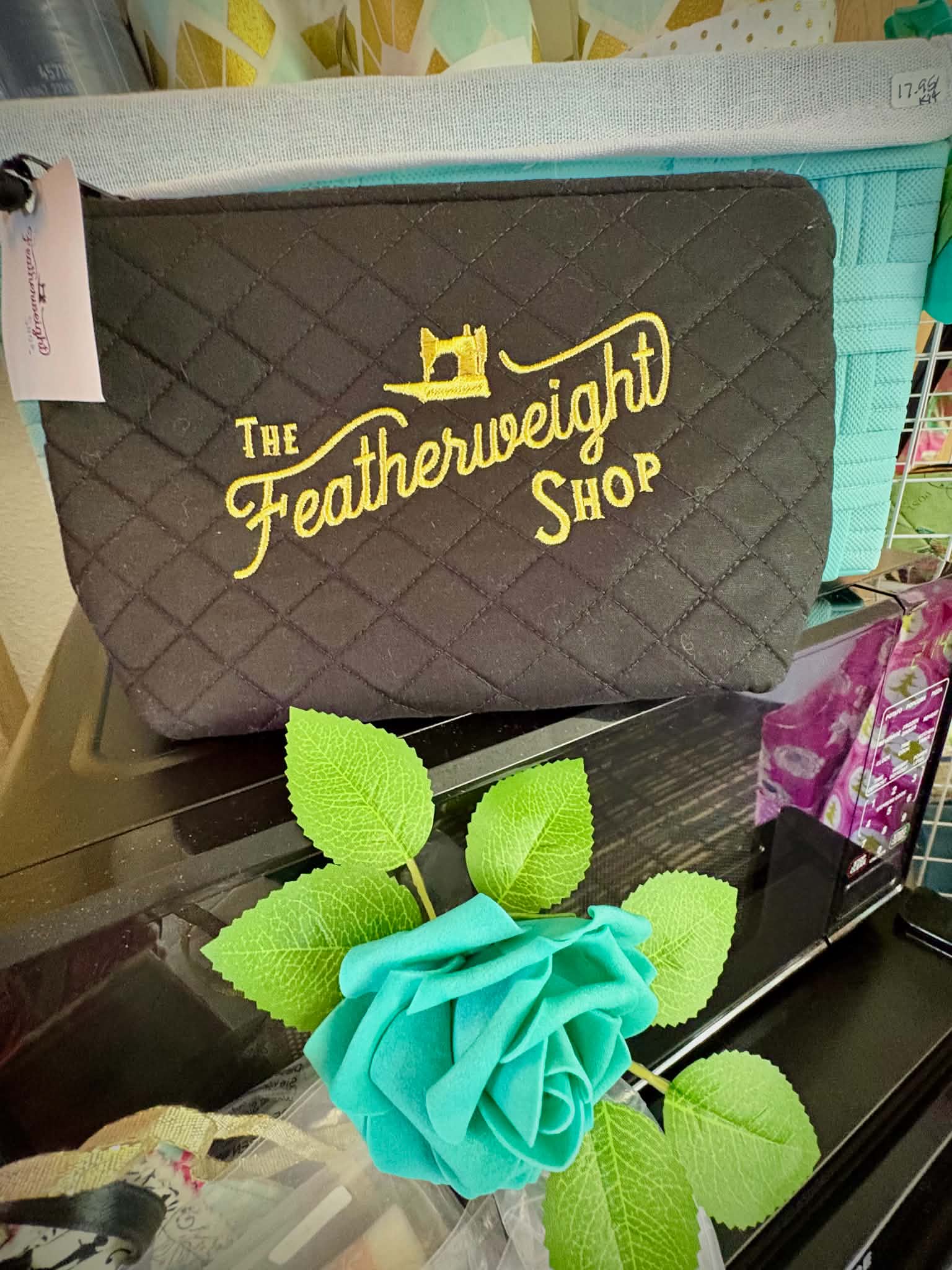The Featherweight Shop quilted bag with teal rose at retreat